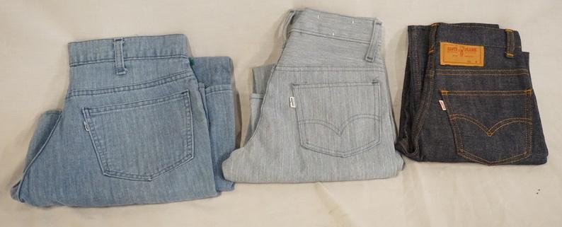 LOT OF 3 PAIRS OF VINTAGE LEVI'S JEANS W/ WHITE TABS &: LOT OF THREE PAIRS OF VINTAGE LEVI STRAUSS & COMPANY JEANS W/ WHITE TABS & BIG E, VARYING DEGREE OF WEAR