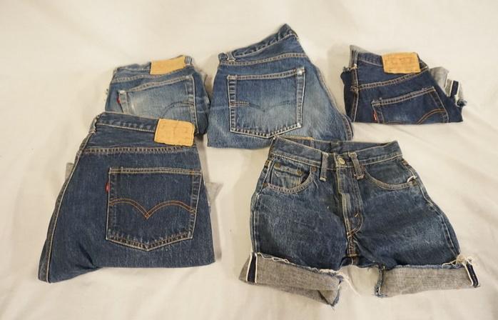 LOT OF 5 PAIRS OF VINTAGE LEVIS SELVEDGE JEANS W/ BIG: LOT OF FIVE PAIRS OF VINTAGE LEVI STRAUSS & COMPANY SELVEDGE JEANS W/ BIG E THAT HAVE BEEN CUT INTO SHORTS, INCLUDING 551ZXX W 33, 501 W 36 IN, 302 W 24, 554 ZXX W 29, & 501 W 29