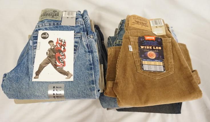 LOT OF 9 PAIRS OF LEVI'S JEANS NEW W/ TAGS: LOT OF NINE PAIRS OF LEVIS JEANS. NEW W/ TAGS, INCLUDING TWO USA MADE CIRCA 80S/90S. SIZES 6, 7, & 8