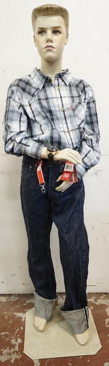 BOY MANNEQUIN CLOTHED WITH VINTAGE SELVEDGE LEVI JEANS: BOY MANNEQUIN CLOTHED WITH VINTAGE SELVEDGE LEVI JEANS WITH BIG E, NEW LEVI WESTERN SHIRT WITH TAGS, SKNEI WATCH AND KEY CHAIN. MANNEQUIN IS APPROXIMATELY 59 IN TALL WITH STAND. MANNEQUIN SOLD AS IS M