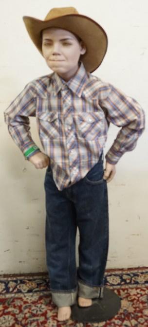 YOUNG BOY MANNEQUIN CLOTHED WITH SELVEDGE BIG E JEANS: YOUNG BOY MANNEQUIN CLOTHED WITH SELVEDGE BIG E JEANS, VINTAGE WRANGER WESTERN SHIRT, WINFIELD COVER SAN FANFRANCISCO CO HAT WITH FEATHER TRIM. MANNEQUIN IS APPROXIMATELY 48 IN TALL WITH STAND.. MANNE