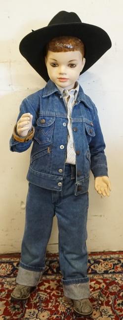 YOUNG BOY MANNEQUIN WITH VINTAGE WRANGLER JEANS: YOUNG BOY MANNEQUIN WITH VINTAGE WRANGLER JEANS AND JACKET, MILLER WESTERN WEAR SHIRT, WESTERN BOOTS, BRACELET AND SILVER CANYON HAT. MANNEQUIN IS APPROXIMATELY 40 IN TALL. MANNEQUIN SOLD AS IS MAY HA