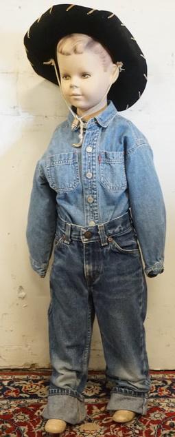 YOUNG BOY MANNEQUIN CLOTHED WITH HIGH SIERRA JEANS: YOUNG BOY MANNEQUIN CLOTHED WITH HIGH SIERRA JEANS, VINTAGE LEVI SHIRT AND NEWARK FELT NOVELTY WESTERN HAT. MANNEQUIN HAS NO ARMS AND IS APPROXIMATELY 38 IN TALL. MANNEQUIN SOLD AS IS MAY HAVE LOSSES.