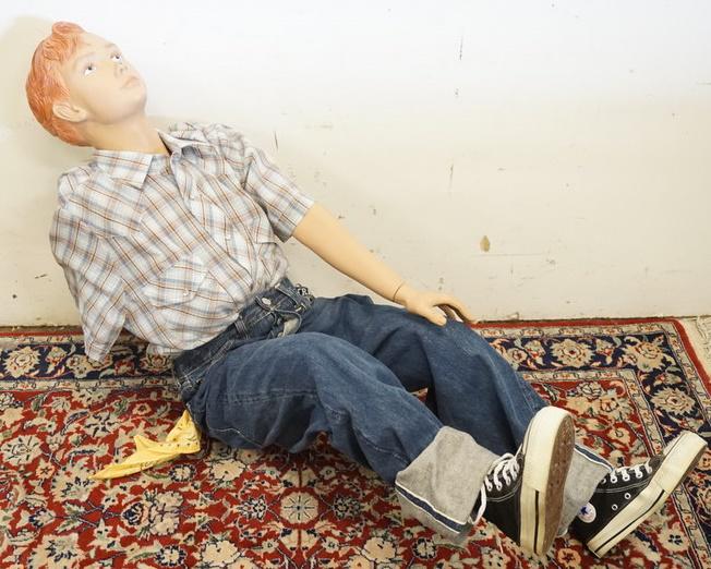 YOUNG MALE SEATED MANNEQUIN CLOTHED WITH VINTAGE: YOUNG MALE SEATED MANNEQUIN CLOTHED WITH VINTAGE SELVEDGE BIG E LEVIS, VINTAGE CONVERSE SIZE 5 1/2 SNEAKERS, BANDANNA AND IMPLUSE WESTERN SHIRT. MANNEQUIN IS MISSING AN ARM AND IS APPROXIMATELY 25 IN 