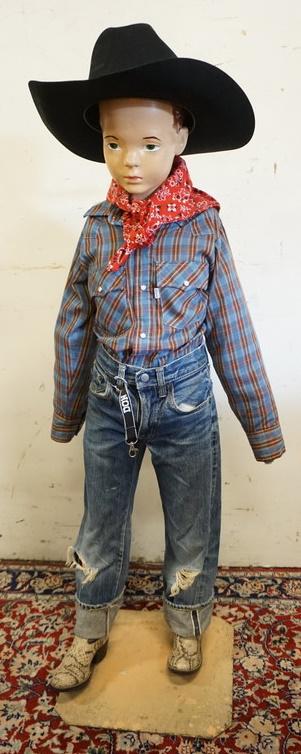 YOUNG BOY MANNEQUIN CLOTHED WITH VINTAGE SELVEDGE LEVI: YOUNG BOY MANNEQUIN CLOTHED WITH VINTAGE SELVEDGE LEVI JEANS, VINTAGE LEVI SHIRT WITH WHITE TAB, BANDANNA, WESTERN BOOTS AND STETSON BEAVER 4 BEAVER HAT. MANNEQUIN HAS NO ARMS AND IS APPROXIMATELY 50 