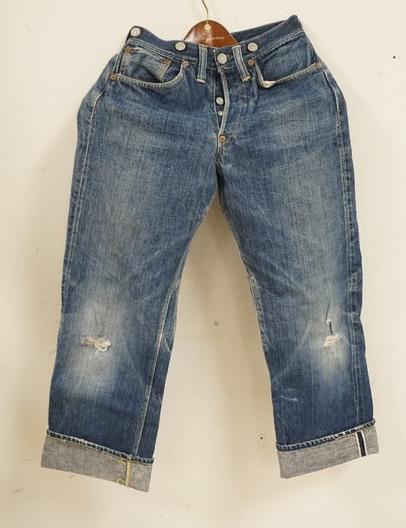 VINTAGE LEVIS CINCH BACK SELVEDGE JEANS CIRCA 1930S: VINTAGE LEVI STRAUSS & COMPANY CINCH BACK SELVEDGE JEANS. JEANS APPEAR TO BE FROM THE EARLY 1930S W/ CINCH BACK, SUSPENDER BUTTONS & RIVETS STILL REMAINING, MEASURES APPROXIMATWLY 24 X 27 1/2 IN