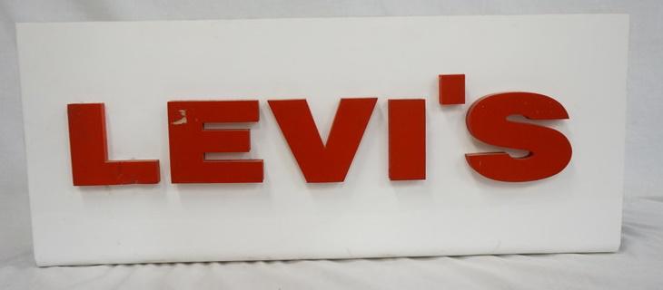 LEVIS LIGHT UP SIGN: LEVIS LIGHT UP SIGN, DOES NOT LIGHT UP. SOME DAMAGE TO LETTERING ON FRONT 30 IN L 12 1/4 IN H
