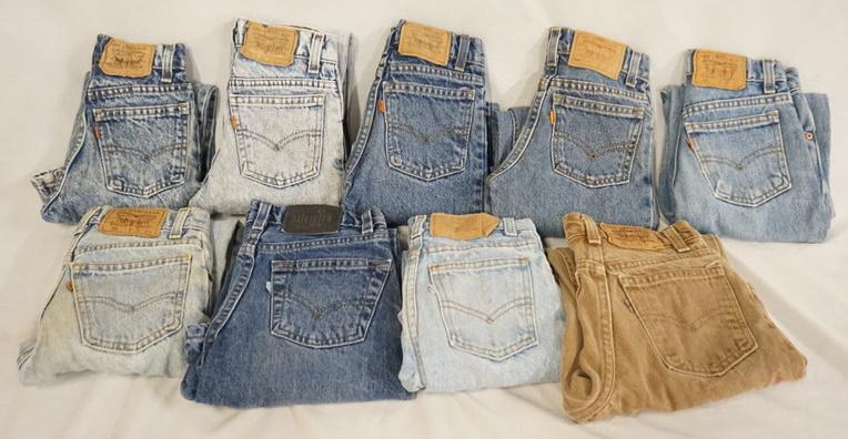 LOT OF 9 PAIRS OF VINTAGE USA MADE LEVI'S JEANS MOSTLY: LOT OF NINE PAIRS OF VINTAGE USA MADE YOUTH SIZED LEVI STRAUSS & COMPANY JEANS SIX ARE ORANGE TAB, THE OTHERS ARE WHITE, TAN & SILVER. SEVEN PAIRS ARE SIZE 8, TWO ARE SIZE 10. VARYING DEGREES OF WEAR