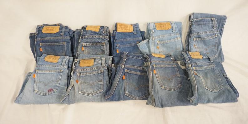 LOT OF 10 PAIRS OF VINTAGE USA MADE LEVI'S JEANS W/: LOT OF TEN PAIRS OF VINTAGE USA MADE LEVI STRAUSS & COMPANY JEANS W/ ORANGE TABS. ALL ARE YOUTH SIZES; 14, TWO ARE SIZE 11, THREE ARE SIZE 12 & FOUR ARE SIZE 9. VARYING DEGREES OF WEAR