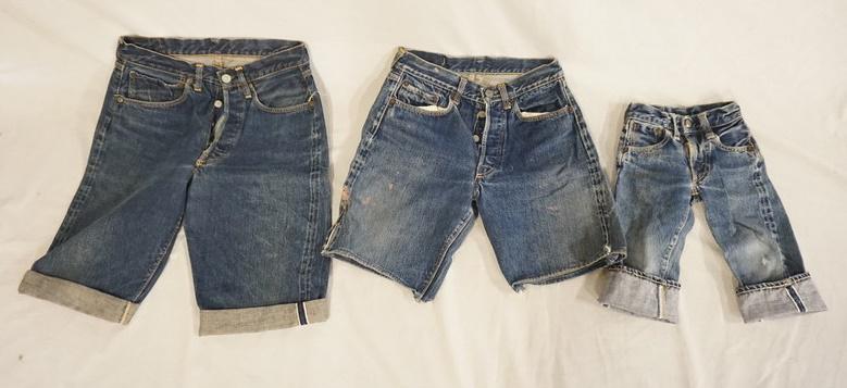 VINTAGE LEVI'S SELVEDGE SHORTS & CHILDS JEANS W/ BIG E: LOT OF TWO PAIRS OF VINTAGE LEVI STRAUSS & COMPANY SELVEDGE SHORTS W/ BIG E & A PAIR OF SMALL CHILD SIZED SELVEDGE JEANS. VARYING DEGREES OF WEAR