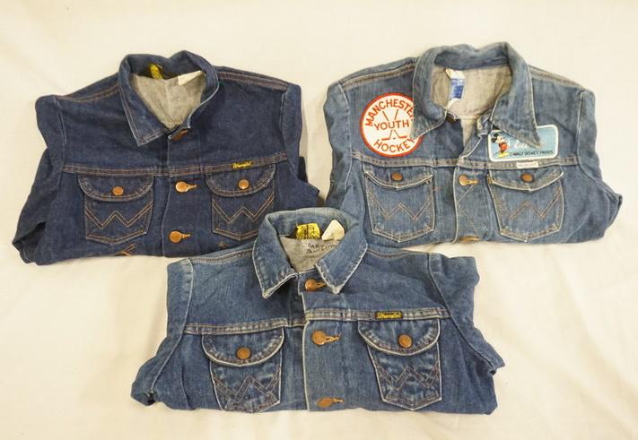 LOT OF 3 VINTAGE WRANGLER DENIM JACKETS: LOT OF THREE VINTAGE WRANGLER DENIM JACKETS ALL ARE MARKED MADE IN USA. ONE JACKET IS DECORATED W/ VARIOUS PATCHES SIZE IS FADED IT MEASURES APP. 15 1/2 IN SHOULDER TO SHOULD, THE OTHER TWO ARE SIZES 