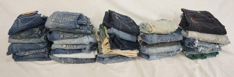 LOT OF 37 PAIRS OF VINTAGE LEVI'S JEANS. ALL ARE: LOT OF 37 PAIRS OF VINTAGE LEVI'S JEANS ALL ARE SHORTS/HAVE BEEN CUT INTO SHORTS. VARYING DEGREES OF WEAR