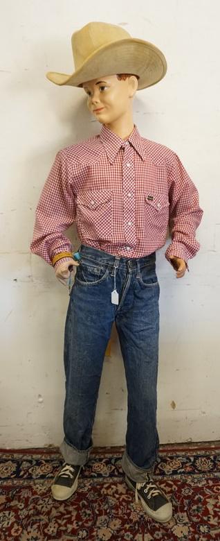 BOY MANNEQUIN CLOTHED IN VINTAGE LEVIS SELVEDGE BIG E: BOY MANNEQUIN CLOTHED IN VINTAGE SELVEDGE LEVIS JEANS W/ BIG E, PRO KEDS SNEAKERS, VINTAGE WRANGLER SHIRT & A GW COWBOY HAT. IS MISSING A FINGER ON LEFT HAND. APP. 60 IN TALL. MANNEQUIN MAY SUFFER LOS