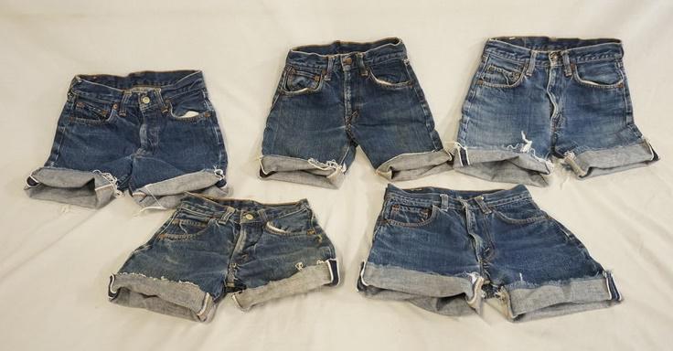 LOT OF 5 PAIRS OF VINTAGE LEVIS SELVEDGE JEANS CUT INTO: LOT OF FIVE PAIRS OF LEVIS SELVEDGE JEANS THAT HAVE BEEN CUT INTO SHORTS ALL APPEAR TO BE YOUTH SIZES. VARYING DEGREES OF WEAR