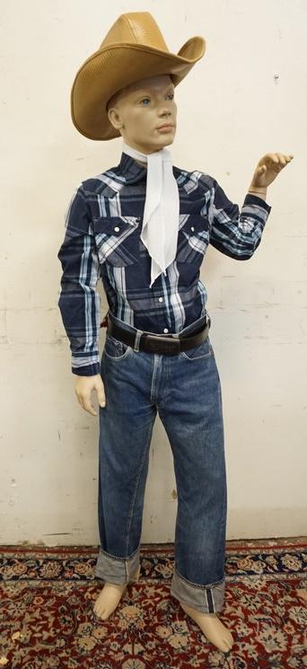 BOY MANNEQUIN CLOTHED IN VINTAGE SELVEDGE LEVIS JEANS: BOY MANNEQUIN CLOTHED IN VINTAGE LEVIS SELVEDGE JEANS W/ BIG E, BELT W/ LEVIS BELT BUCKLE, ARIZONA SHIRT, ASCOT, & CASSIDY HATS COWBOY HAT. APP. 58 IN TALL. MANNEQUIN MAY SUFFER LOSSES TO BODY/FACE