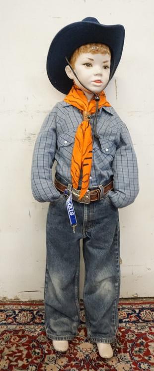 YOUNG BOY MANNEQUIN CLOTHED IN VINTAGE LEVIS JEANS &: YOUNG BOY MANNEQUIN CLOTHED IN VINTAGE LEVIS JEANS, LEVIS SHIRT, SWAGGER SCARF W/ WESTERN SCENE, BOOT HILL FEATHERED COWBOY HAT, BELT W/ BULLS HEAD BELT BUCKLE. APP. 45 IN TALL. HAS NO ARMS, MANNEQUIN
