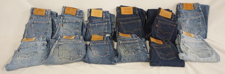 LOT OF 12 PAIRS OF VINTAGE LEVIS JEANS: LOT OF 12 PAIRS OF VINTAGE LEVIS JEANS. MOST APPEAR TO BE YOUTH SIZES, ONE PAIR HAS BEEN CUT INTO SHORTS. VARYING DEGREES OF WEAR