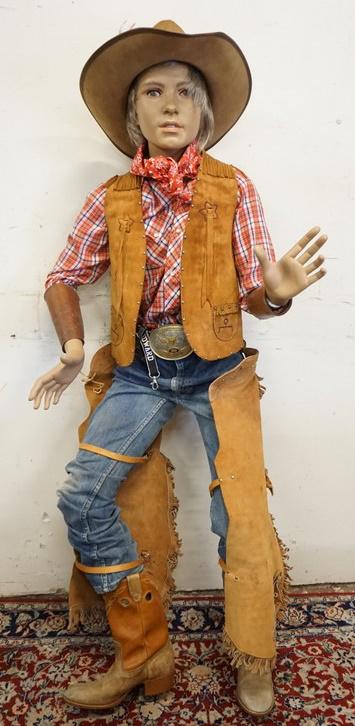 BOY MANNEQUIN CLOTHED IN VINTAGE LEVIS & WESTERN ATTIRE: BOY MANNEQUIN CLOTHED IN VINTAGE LEVIS JEANS, DINGO COWBOY BOOTS, CHAPS, BELT W/ BELT BUCKLE WHICH READS *FIRST PLACE. ALL AMERICAN YOUTH HORSE SHOW* ARM BANDS, VEST, WESTERN FASHION VINTAGE SHIRT, BA