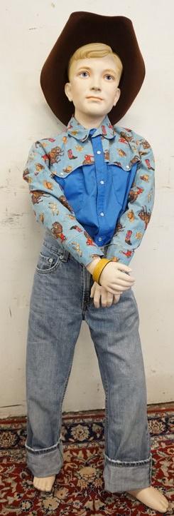 BOY MANNEQUIN CLOTHED IN LEVIS JEANS: BOY MANNEQUIN CLOTHED IN LEVIS JEANS, VINTAGE WESTERN SHIRT, & COWBOY HAT. APP. 53 IN TALL. MANNEQUIN MAY SUFFER LOSSES TO BODY/FACE