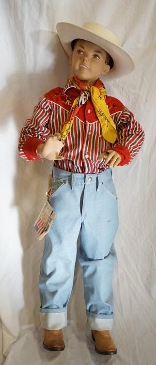 BOY MANNEQUIN IN ROY ROGERS RELATED CLOTHING: BOY MANNEQUIN CLOTHED IN VINTAGE WRANGLER JEANS W/ COLORING BOOKLET ATTACHED COPY RIGHT DATED 1962, COWBOY BOOTS, ROY ROGERS WESTERN SHIRT, ROY ROGERS BANDANNA, & A ROY ROGERS COWBOY HAT. IS MISSING F