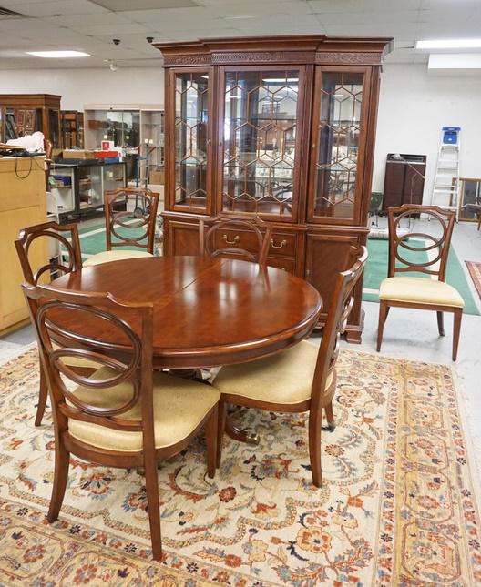 BASSETT DINING ROOM SET: BASSETT DINING ROOM SET, BREAKFRONT, 53 IN ROUND TABLE W/ONE 24 IN LEAVE & A SET OF 6 CHAIRS