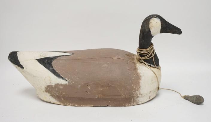 LARGE CARVED WOODEN GOOSE DECOY W/ WEIGHT: LARGE CARVED WOODEN GOOSE DECOY W/ WEIGHT NUMBERED ON THE BASE 23 IN L