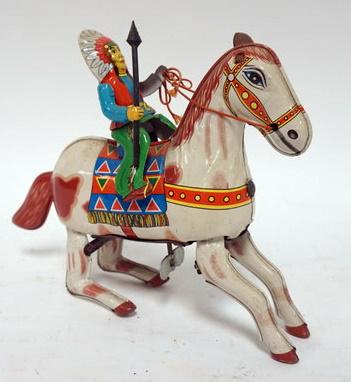 ANTIQUE TIN WIND UP TOY INDIAN CHIEF: ANTIQUE TIN WIND UP TOY INDIAN CHIEF RIDING HORSE, 1 LEATHER EAR MISSING ON HORSE, SPRING GOOD MARKED HAJI JAPAN