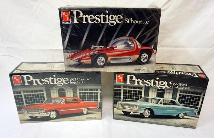 3 AMT ERTL PRESTIGE MODEL CAR KITS: LOT OF 3 AMT ERTL PRESTIGE MODEL CAR KITS, 2 SEALED, 1 OPEN KITS ARE POSSIBLY COMPLETE, NOT GUARANTEED