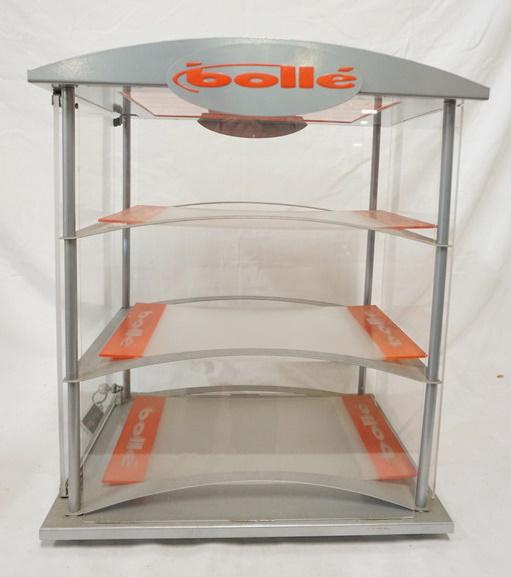 3 TIER PLASTIC BOLLE DISPLAY SHOW CASE: THREE TIER PLASTIC BOLLE DISPLAY CASE W/ LOCKING DOOR & KEY ON SIDE. 21 1/2 IN X 18 IN. 14 1/2 IN DEEP
