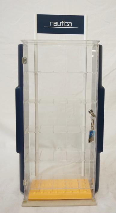 MULTI TIER NAUTICA DISPLAY CASE: MULTI TIER PLASTIC NAUTICA DISPLAY CASE W/ LOCKING DOOR & KEY. 24 1/2 IN X 11 1/2 IN 5 IN DEEP