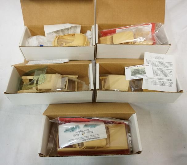 LOT OF 5 MODEL CAR RESIN KITS: LOT OF FIVE MODEL CAR RESIN KITS. POSSIBLY COMPLETE NOT GUARANTEED.