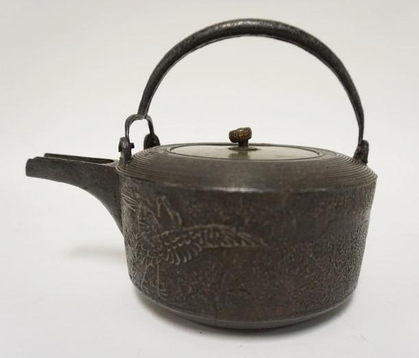 ASIAN CAST TEAPOT: ASIAN CAST TEAPOT W/BRASS LID & EMBOSSED CRANES ON EXTERIOR, 6 1/4 IN HIGH