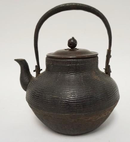 ASIAN CAST IRON TEAPOT: ASIAN CAST IRON TEAPOT W/BASKET WEAVE DESIGN AROUND EXTERIOR & BRONZE LID, 8 IN HIGH