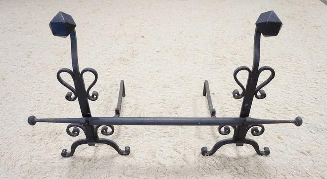 PAIR OF LARGE WROUGHT IRON ANDIRONS W/ CROSS BAR: PAIR OF LARGE WROUGHT IRON ANDIRONS W/ CROSS BAR. 28 IN H 24 IN DEEP THE CROSS BAR IS 46 IN W