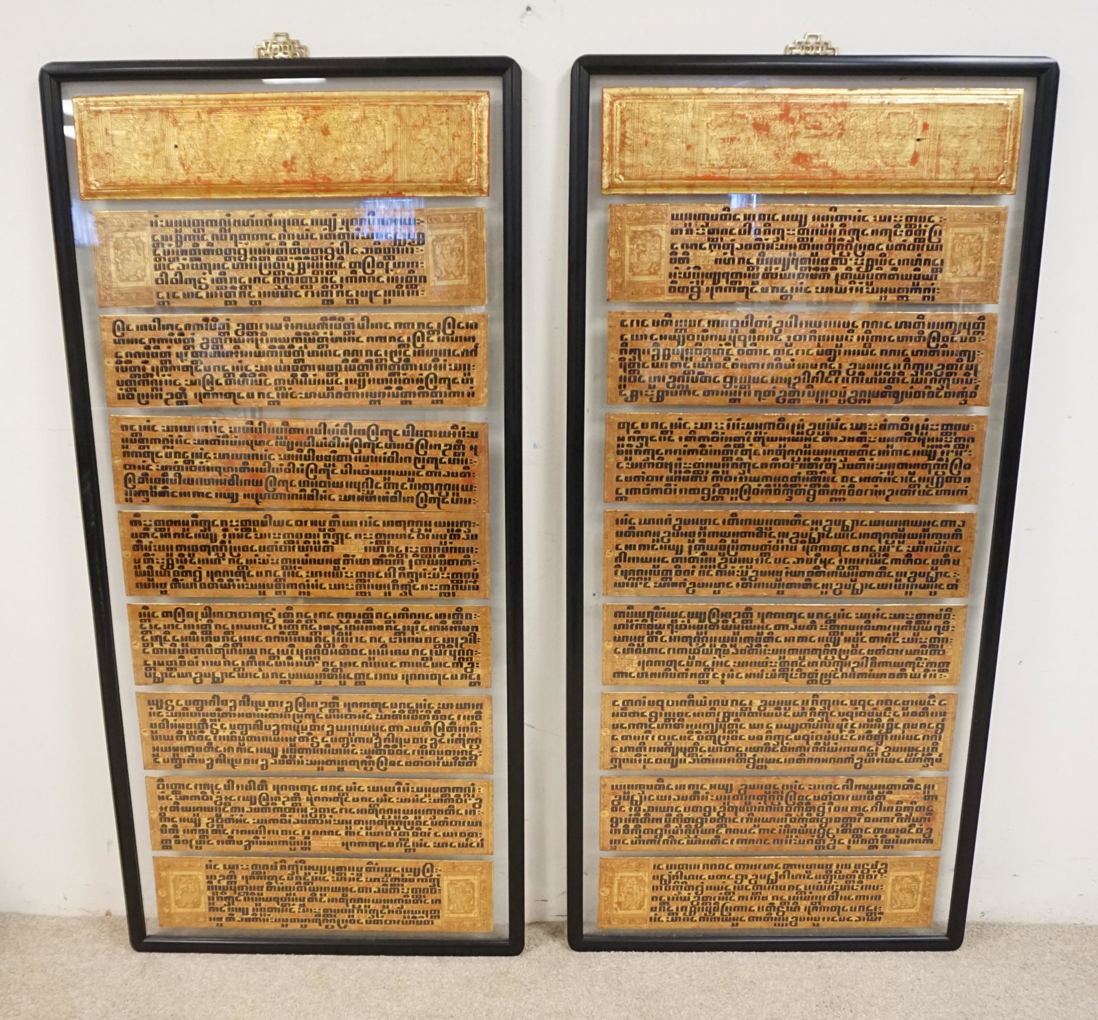BURMESE BIBLES IN LARGE DOUBLE SIDED GLASS: BURMESE BIBLES IN LARGE DOUBLE SIDED GLASS, 56 1/2 IN HIGH X 27 IN WIDE