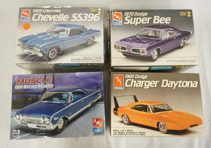 LOT OF 4 AMT ERTL MODEL CAR KITS: LOT OF FOUR AMT ERTL MODEL CAR KITS. POSSIBLY COMPLETE NOT GUARANTEED.