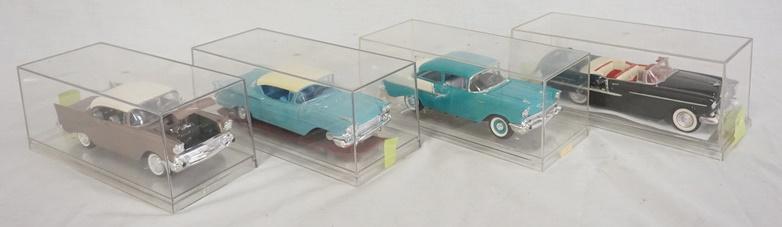 LOT OF 4 BUILT MODEL KITS OF VINTAGE CARS: LOT OF FOUR BUILT MODEL KITS OF VINTAGE CARS, ALL ARE CHEVROLET. ONE MODEL CHEVY IMPALA THE TIRE NEEDS TO BE REATTACHED. ALL ARE IN DISPLAY CASES