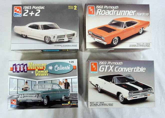LOT OF 4 AMT ERTL MODEL CAR KITS: LOT OF FOUR AMT ERTL MODEL CAR KITS. POSSIBLY COMPLETE NOT GUARANTEED.