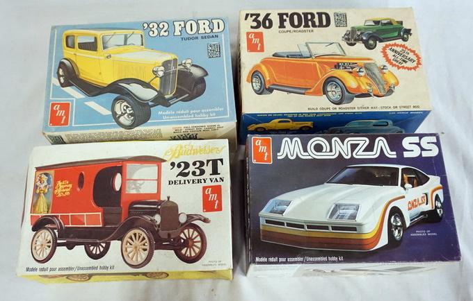 LOT OF 4 AMT MODEL CAR KITS: LOT OF FOUR AMT MODEL CAR KITS. POSSIBLY COMPLETE NOT GUARANTEED.