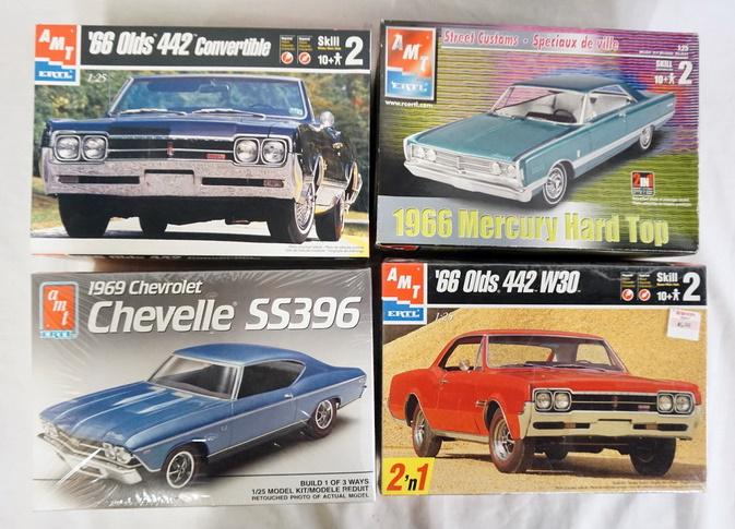 LOT OF 4 AMT ERTL MODEL CAR KITS: LOT OF FOUR AMT ERTL MODEL CAR KITS. POSSIBLY COMPLETE NOT GUARANTEED.