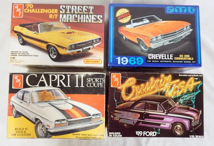 LOT OF 4 AMT MODEL CAR KITS: LOT OF FOUR AMT MODEL CAR KITS. POSSIBLY COMPLETE NOT GUARANTEED.