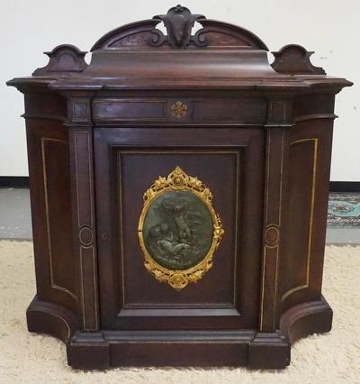 VICTORIAN CREDENZA W/BRONZE PLAQUE: VICTORIAN CREDENZA W/BRONZE PLAQUE, BEADING MISSING ON LEFT SIDE OF THE TOP PLATEAU & A SPLIT IN THE WOOD, PLAQUE DEPICTS PUTTI W/BUNCHES OF GRAPES, HAS ONE DOOR W/INTERIOR SHELF, 49 IN WIDE X 51 IN H