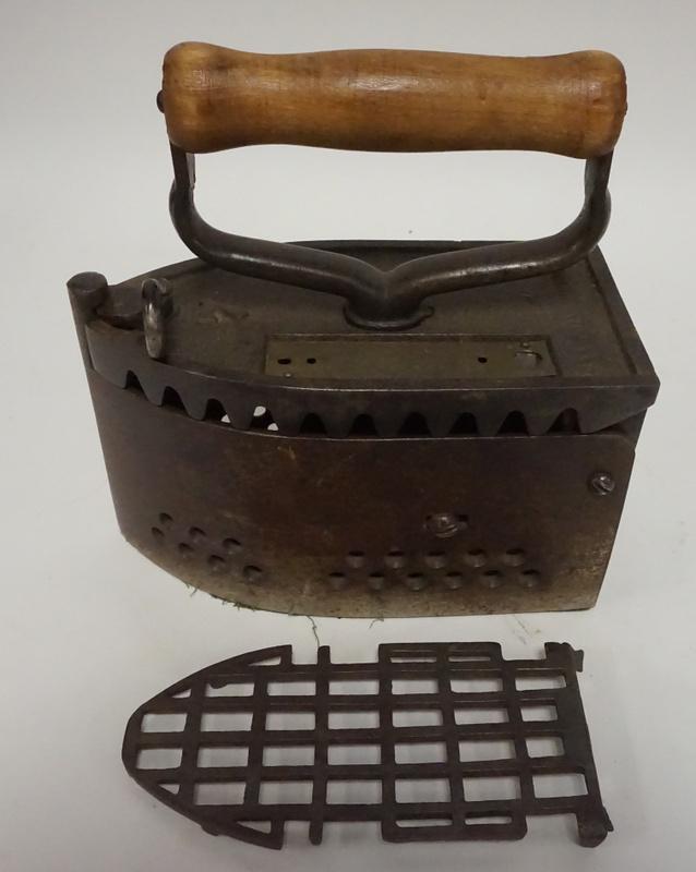 1889 IRON WITH TRIVET AND THERMOMETER PLATE: 1889 IRON WITH TRIVET AND THERMOMETER PLATE. PAT JULY 9TH, 1889, HAS ORIGNAL TRIVET, THERMOMETER GLASS IS MISSING. 7 1/2 IN LONG, 7 3/4 IN HIGH