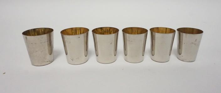 NEST OF 6 SILVER PLATE GOLDWASH SHOT GLASSES: NEST OF 6 SILVER PLATE GOLDWASH SHOT GLASSES, GRADUATED, MADE IN GERMANY, 1 3/4 IN HIGH