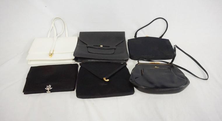 LOT OF 6 VINTAGE PURSES: LOT OF SIX VINTAGE PURSES. THREE OF THE PURSES ARE SIGNED KORET, ONE IS LORD & TAYLOR, ONE IS ROSENFELD & ONE HAS A LIONS HEAD. VARYING DEGREES OF WEAR AS FOUND.