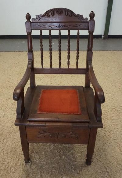 CARVED COMMODE CHAIR W/TURNED SPINDLE BACK: CARVED COMMODE CHAIR W/TURNED SPINDLE BACK, HAS INSERT
