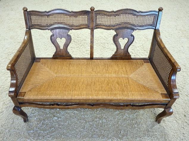 RUSH BOTTOM LOVE SEAT: CARVED & CANED RUSH BOTTOM LOVE SEAT, HAS A CUSHION. 47 IN W