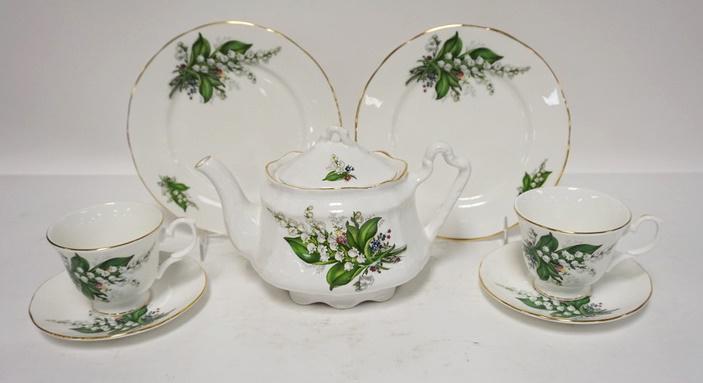 8 PIECES OF LILY OF THE VALLEY BONE CHINA: 8 PIECES OF LILY OF THE VALLEY BONE CHINA, A TEAPOT; 6 IN H, TWO CUPS, TWO SAUCERS & TWO 8 1/2 IN PLATES