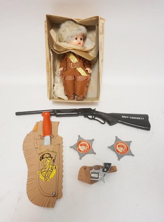 LOT DAVY CROCKETT TOYS: LOT DAVY CROCKETT TOYS, DOLL IN BOX, KNIFE, RIFLE, HOLSTER, 2 BADGES & PISTOL-NOT DAVY CROCKETT, MARKED PAINT