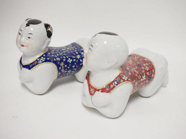 PAIR OF ASIAN PORCELAIN FIGURAL PILLOWS: PAIR OF ASIAN PORCELAIN FIGURAL PILLOWS, 8 3/4 IN LONG X 7 IN HIGH